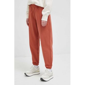 New Balance pantaloni de trening din bumbac culoarea rosu, neted de firma original