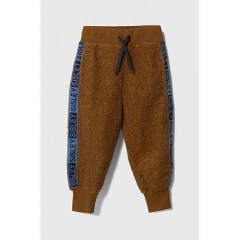 Sisley pantaloni de trening pentru copii culoarea maro, cu imprimeu
