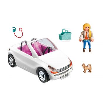 CONVERTIBLE WITH WOMAN AND PUPPY