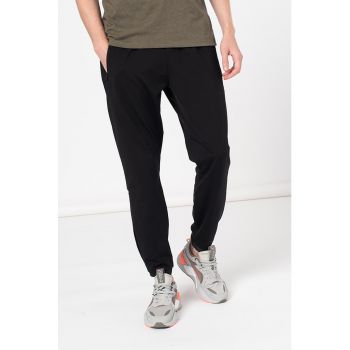 Pantaloni sport cu buzunare oblice cu fermoar