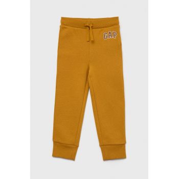 GAP pantaloni de trening pentru copii culoarea galben, neted