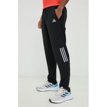 Adidas Performance pantaloni de alergare Own the Run barbati, culoarea negru, cu imprimeu ieftini