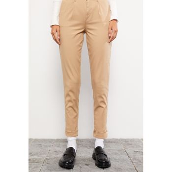 Pantaloni conici cu buzunare oblice