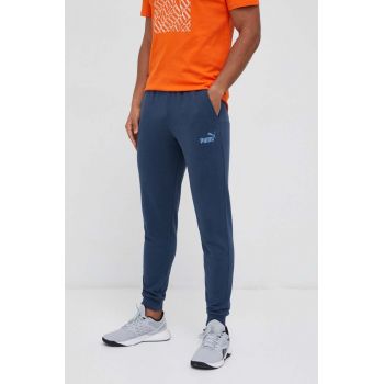 Puma pantaloni de trening culoarea albastru marin, neted