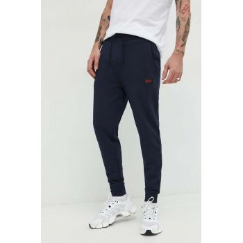 HUGO pantaloni de trening din bumbac barbati, culoarea albastru marin, neted