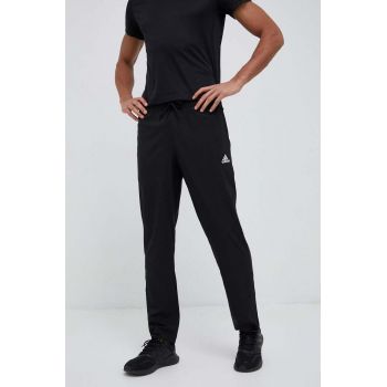 adidas pantaloni de antrenament Essentials Stanford culoarea negru, cu imprimeu ieftini