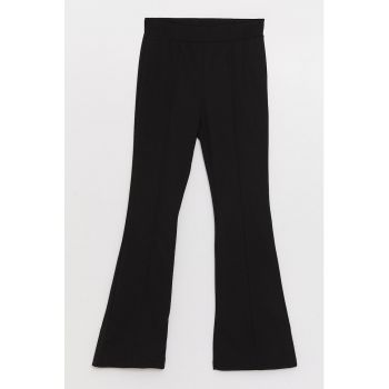 Pantaloni slim fit evazati