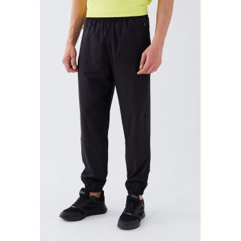 Pantaloni sport conici cu talie elastica