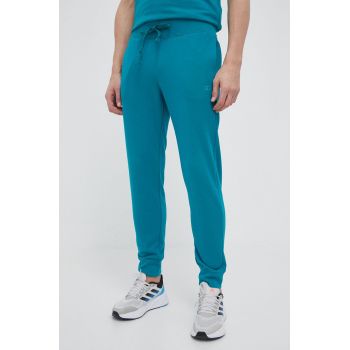 Champion pantaloni de trening culoarea verde, neted ieftini