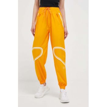 adidas by Stella McCartney pantaloni de antrenament TruePace culoarea portocaliu, cu imprimeu de firma original