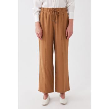 Pantaloni ampli cu buzunare oblice