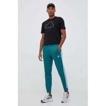 adidas Originals pantaloni de trening IM2110-ARCFUS culoarea turcoaz, cu imprimeu ieftini