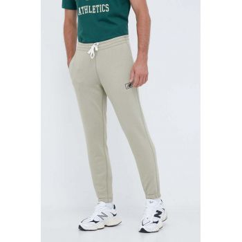 New Balance pantaloni de trening culoarea verde, neted de firma originali