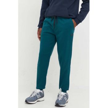 Rip Curl pantaloni de trening barbati, culoarea verde, neted de firma originali
