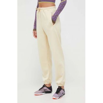 adidas by Stella McCartney pantaloni de trening culoarea galben, neted de firma original
