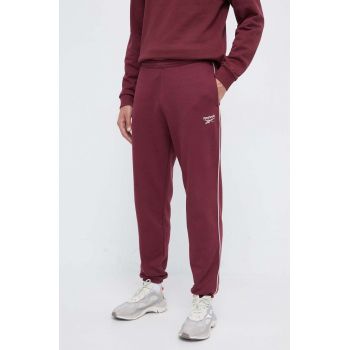 Reebok pantaloni de trening culoarea bordo, neted de firma originali