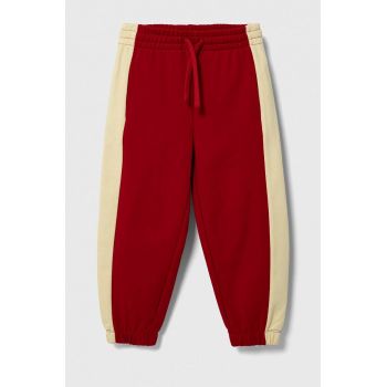 United Colors of Benetton pantaloni de trening din bumbac pentru copii culoarea rosu, modelator ieftini