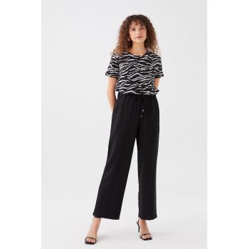 Pantaloni ampli cu buzunare oblice