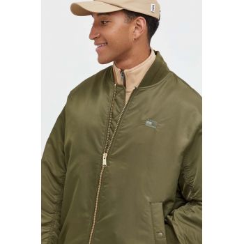 Tommy Jeans geacă bomber culoarea verde, de tranzitie de firma originala