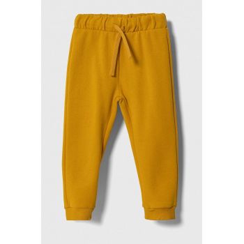United Colors of Benetton pantaloni de trening pentru copii culoarea galben, neted