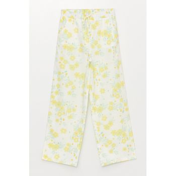 Pantaloni cu imprimeu floral si buzunare oblice