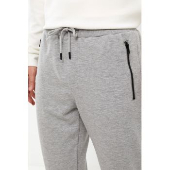 Pantaloni sport din amestec de bumbac cu buzunare cu fermoar