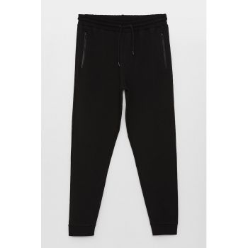 Pantaloni din amestec de bumbac cu buzunare cu fermoar