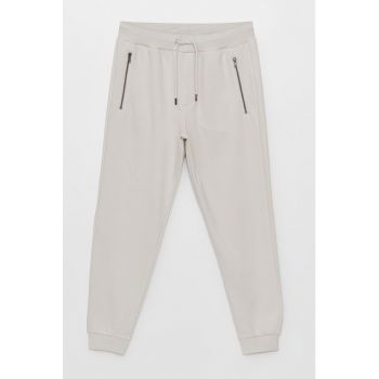 Pantaloni sport cu buzunare cu fermoar