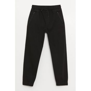 Pantaloni sport cu buzunare oblice cu fermoar
