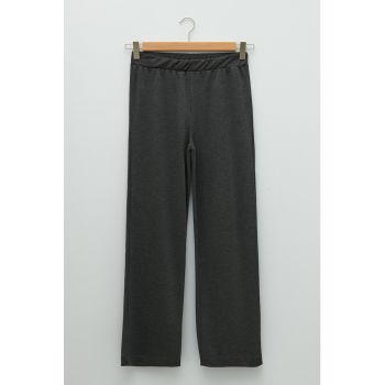 Pantaloni cu croiala ampla si talie inalta