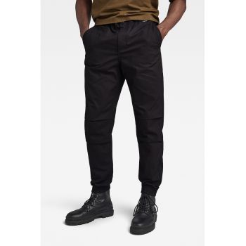 Pantaloni conici cu buzunare oblice