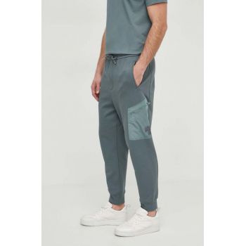 Armani Exchange pantaloni de trening din bumbac culoarea verde, neted