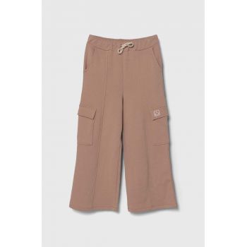 United Colors of Benetton pantaloni de trening din bumbac pentru copii culoarea bej, neted ieftini