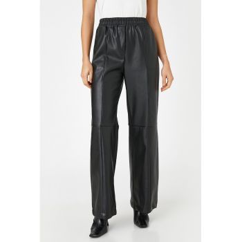 Pantaloni de piele ecologica cu talie elastica