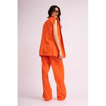 Costum portocaliu neon cu vesta oversized si pantaloni wide leg