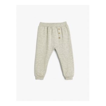 Pantaloni de trening cu nasturi decorativi