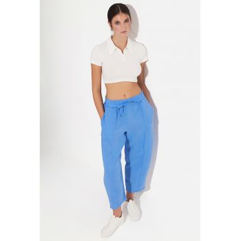 Pantaloni conici cu model uni
