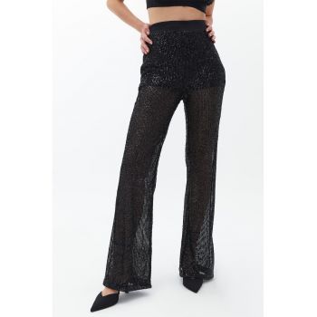 Pantaloni cu croiala ampla si paiete