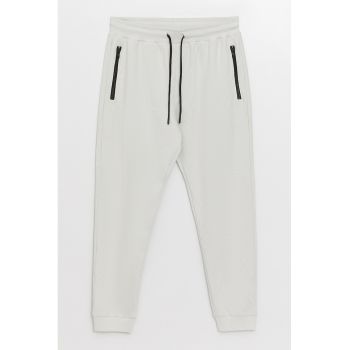 Pantaloni de trening cu buzunare cu fermoar