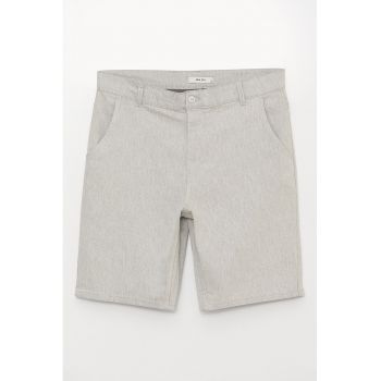 Pantaloni scurti cu buzunare oblice