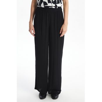 Pantaloni ampli cu talie elastica