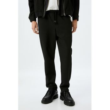 Pantaloni cu snur si buzunare