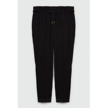 Pantaloni conici cu snur