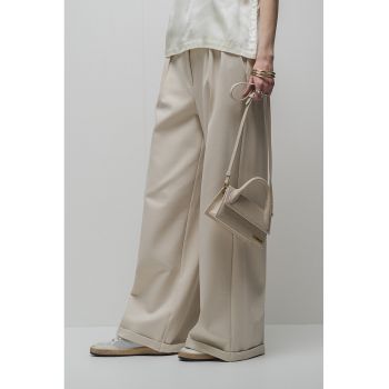 Pantaloni cu croiala ampla si pliuri