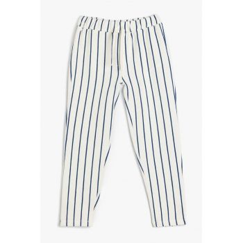 Pantaloni conici cu dungi