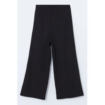 Pantaloni cu croiala ampla si talie elastica