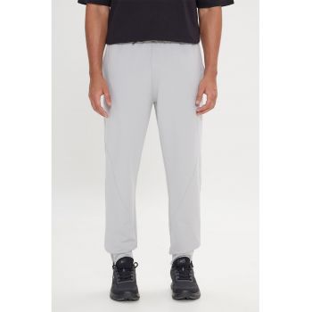 Pantaloni de trening cu snur de ajustare si croiala conica