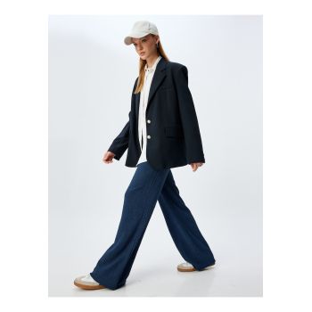 Pantaloni cu croiala ampla si snur de ajustare