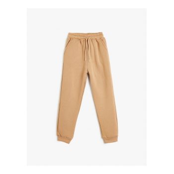 Pantaloni de trening uni cu buzunare oblice