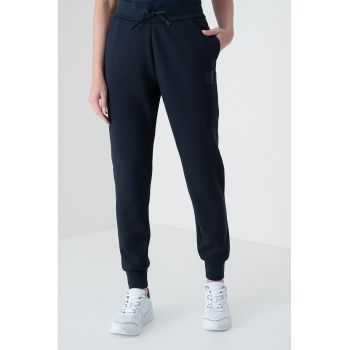 Pantaloni conici de trening